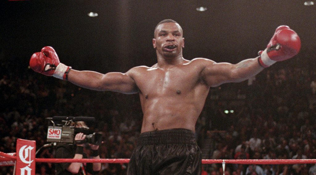 Mike Tyson celebrating in the ring.