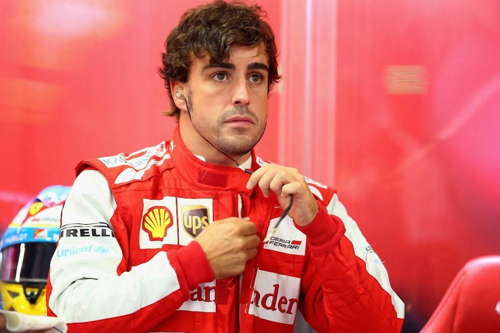 A young Fernando Alonso in the Ferrari garage before a race