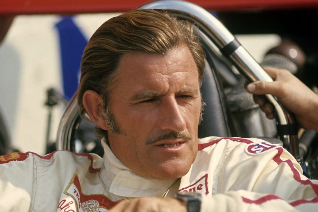 Graham Hill sat in the cockpit of his F1 car